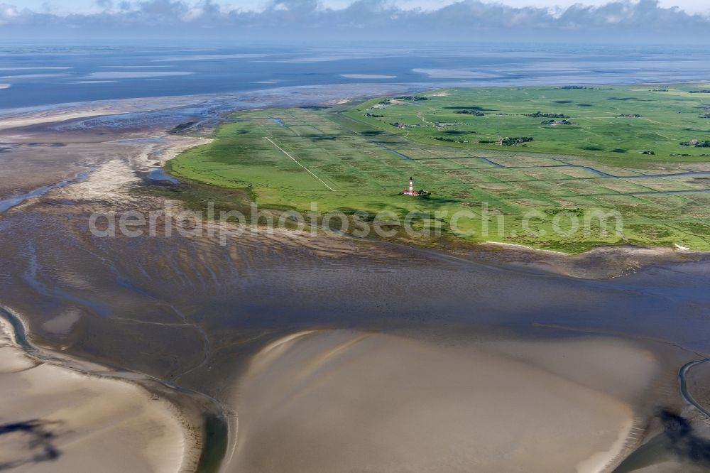 Aerial image westerhever - Lighthouse as a historic seafaring character in the coastal area of North Sea in the district Hauert in Westerhever in the state Schleswig-Holstein