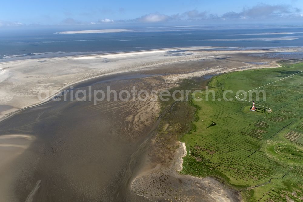 Aerial photograph westerhever - Lighthouse as a historic seafaring character in the coastal area of North Sea in the district Hauert in Westerhever in the state Schleswig-Holstein