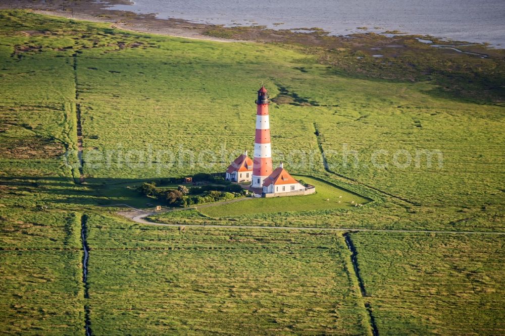 Aerial photograph westerhever - Lighthouse as a historic seafaring character in the coastal area of North Sea in the district Hauert in Westerhever in the state Schleswig-Holstein