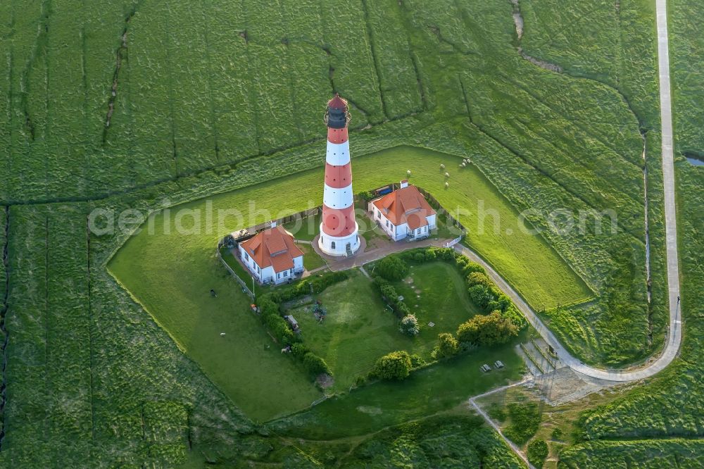 Aerial photograph westerhever - Lighthouse as a historic seafaring character in the coastal area of North Sea in the district Hauert in Westerhever in the state Schleswig-Holstein