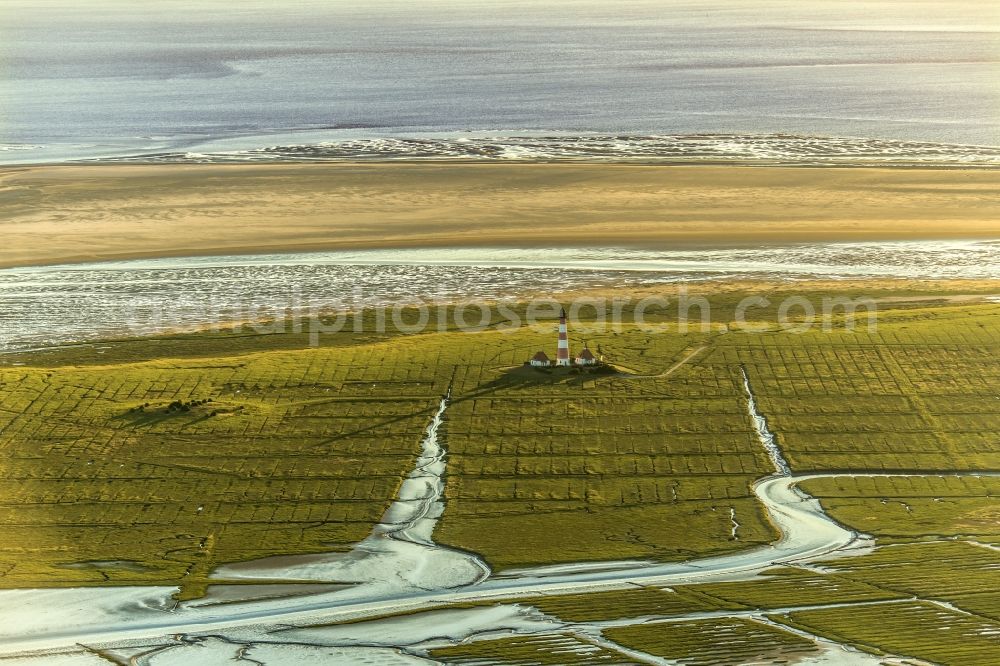 Aerial photograph Westerhever - Lighthouse as a historic seafaring character in the coastal area of North Sea in the district Hauert in Westerhever in the state Schleswig-Holstein