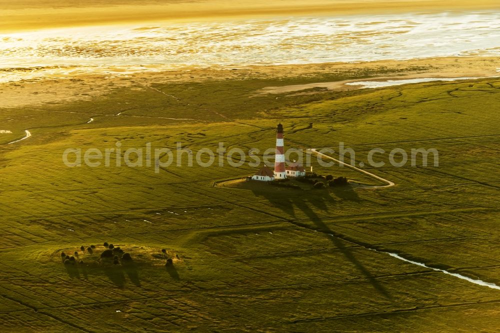 Aerial image Westerhever - Lighthouse as a historic seafaring character in the coastal area of North Sea in the district Hauert in Westerhever in the state Schleswig-Holstein