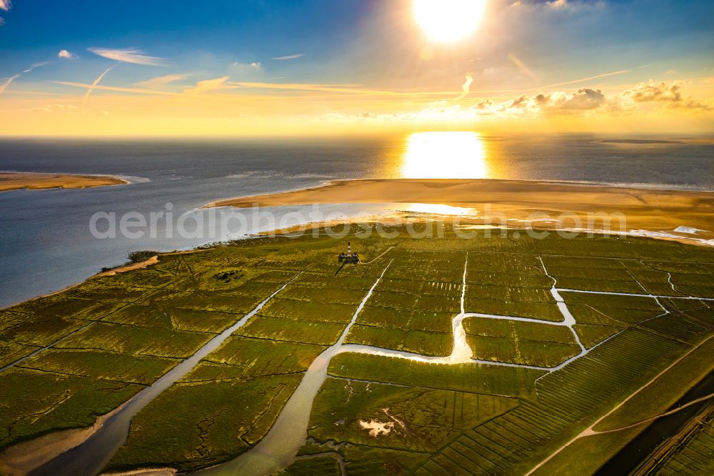 Westerhever from above - Lighthouse as a historic seafaring character in the coastal area of North Sea in the district Hauert in Westerhever in the state Schleswig-Holstein