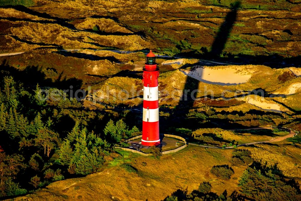 Aerial photograph Nebel - Lighthouse as a historic seafaring character in the coastal area of the North Sea in Wittduen auf Amrum in the state Schleswig-Holstein