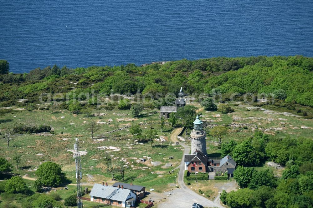 Allinge from above - Lighthouse as a historic seafaring character in the coastal area of Baltic Sea on Bornholm Island in Allinge in Region Hovedstaden, Denmark