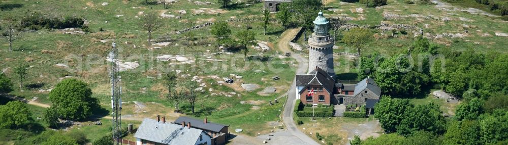 Allinge from the bird's eye view: Lighthouse as a historic seafaring character in the coastal area of Baltic Sea on Bornholm Island in Allinge in Region Hovedstaden, Denmark