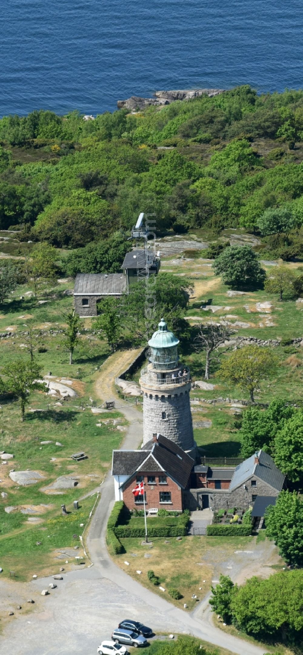 Aerial photograph Allinge - Lighthouse as a historic seafaring character in the coastal area of Baltic Sea on Bornholm Island in Allinge in Region Hovedstaden, Denmark