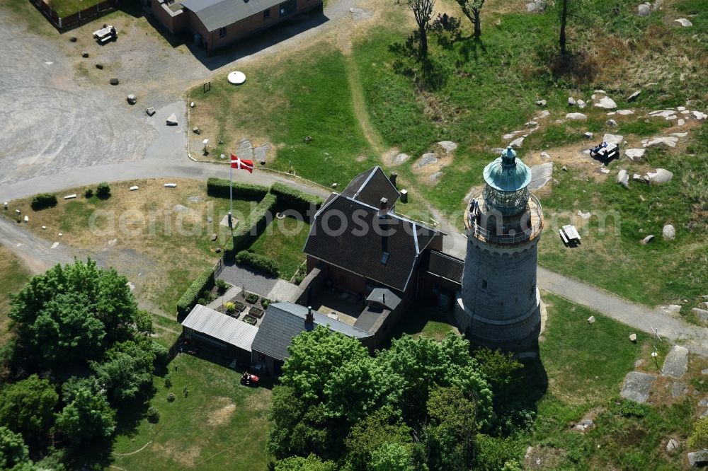 Allinge from the bird's eye view: Lighthouse as a historic seafaring character in the coastal area of Baltic Sea on Bornholm Island in Allinge in Region Hovedstaden, Denmark