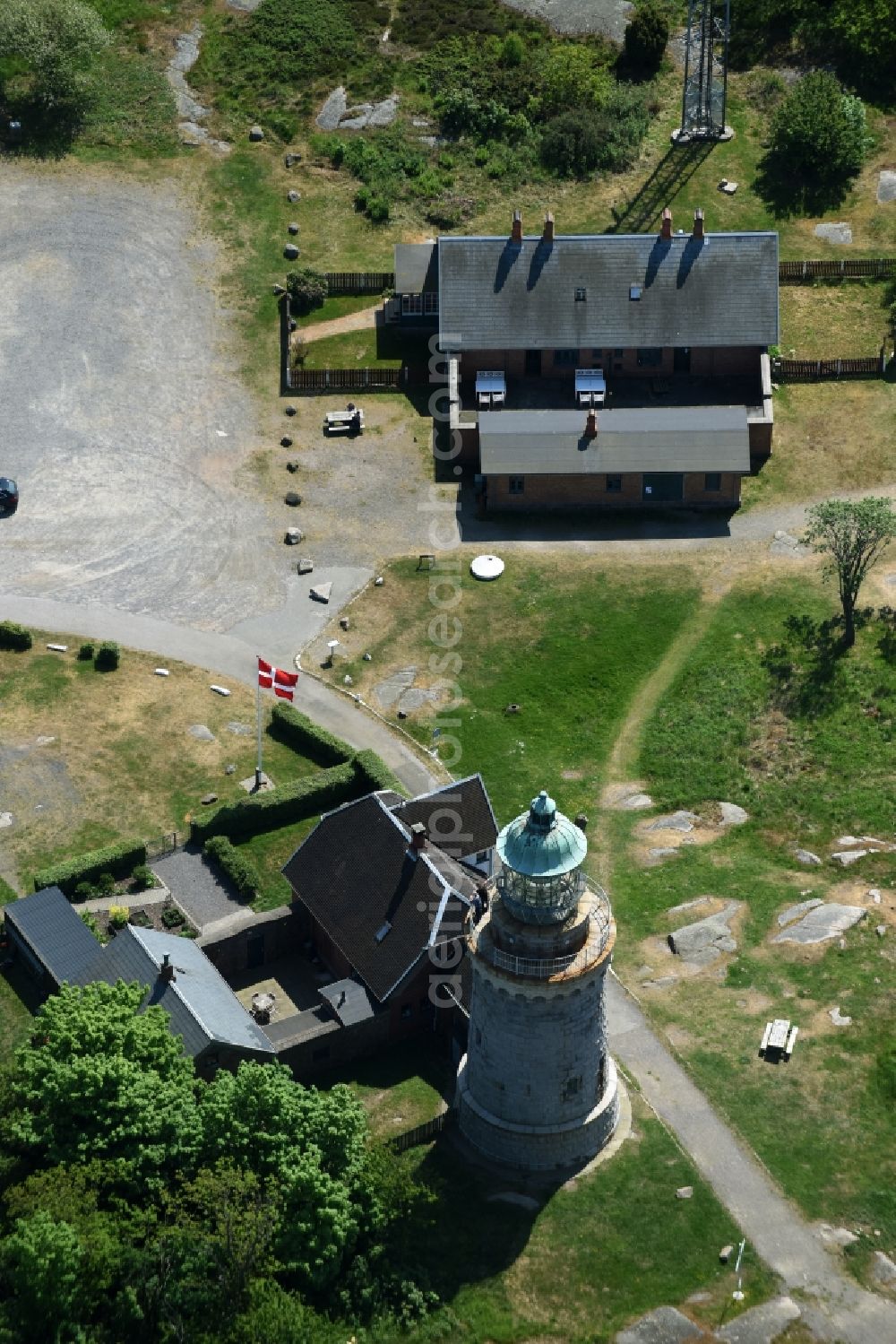 Allinge from above - Lighthouse as a historic seafaring character in the coastal area of Baltic Sea on Bornholm Island in Allinge in Region Hovedstaden, Denmark