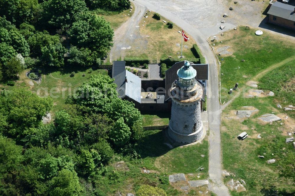 Allinge from above - Lighthouse as a historic seafaring character in the coastal area of Baltic Sea on Bornholm Island in Allinge in Region Hovedstaden, Denmark