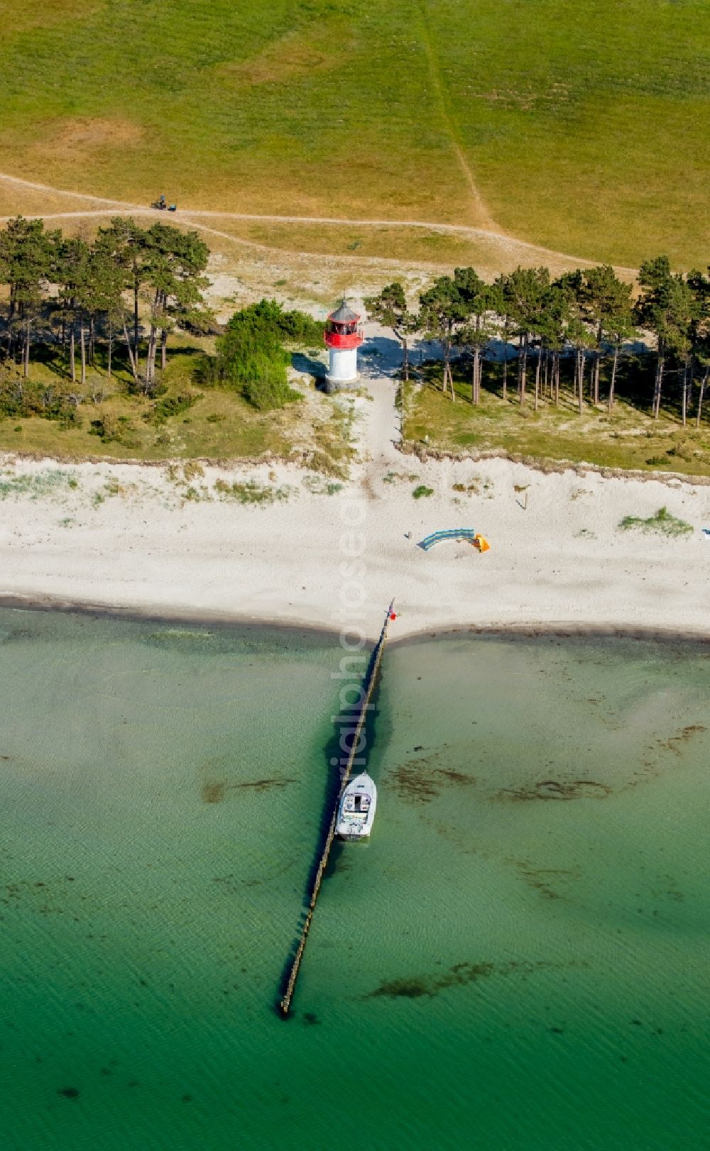 Insel Hiddensee from above - Lighthouse as a historic seafaring character in the coastal area of Plogshagen in Insel Hiddensee in the state Mecklenburg - Western Pomerania