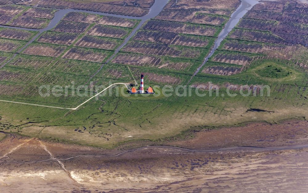 Westerhever from the bird's eye view: Lighthouse as a historical navigation sign in the coastal area Westerheversand in the district of Hauert in Westerhever in the federal state Schleswig-Holstein