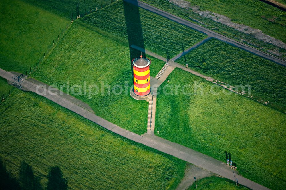 Krummhörn from the bird's eye view: Lighthouse as the historical nautical sign Pilsum lighthouse in Krummhorn in the state Lower Saxony, Germany