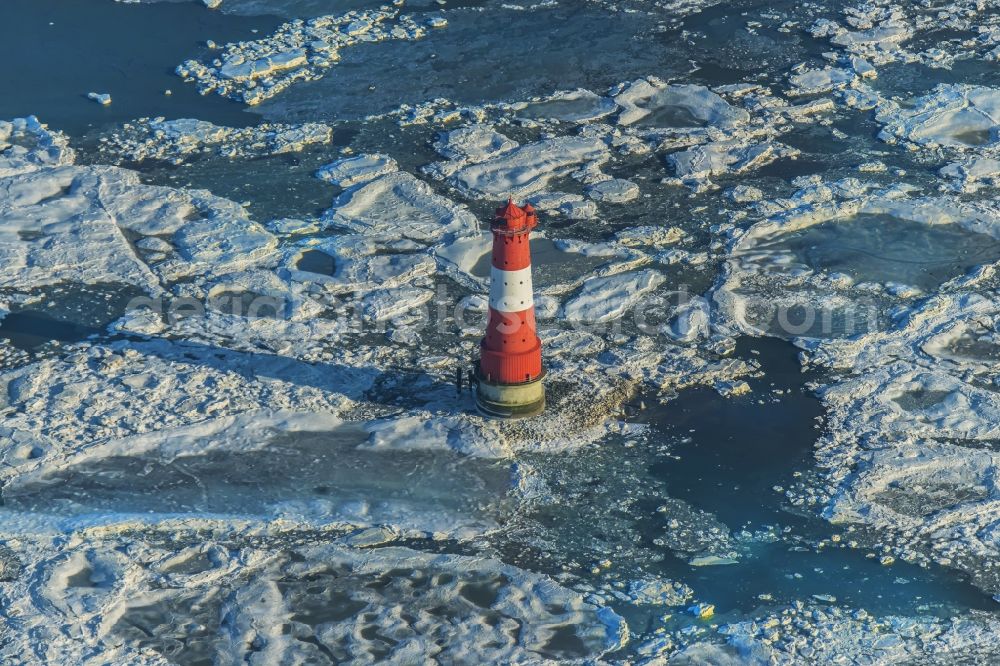 Wilhelmshafen from the bird's eye view: Lighthouse Arngast a nautical sign in the Jadebusen south of Wilhelmshaven in pack ice on a sandbank in the Watt in Lower Saxony Germany