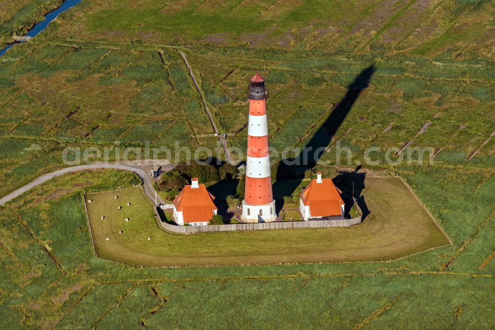 Westerhever from the bird's eye view: Lighthouse Westerheversand as a historic seafaring character in the coastal area of North Sea in Westerhever in the state Schleswig-Holstein