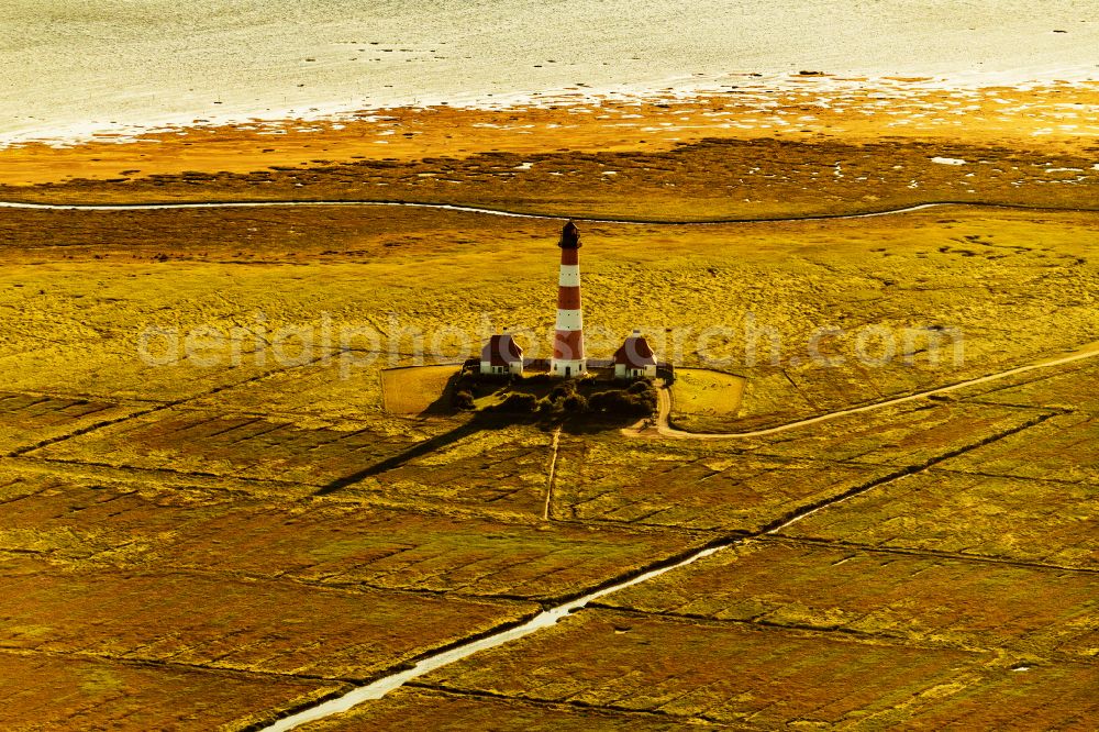 Westerhever from above - Lighthouse Westerheversand as a historic seafaring character in the coastal area of North Sea in Westerhever in the state Schleswig-Holstein