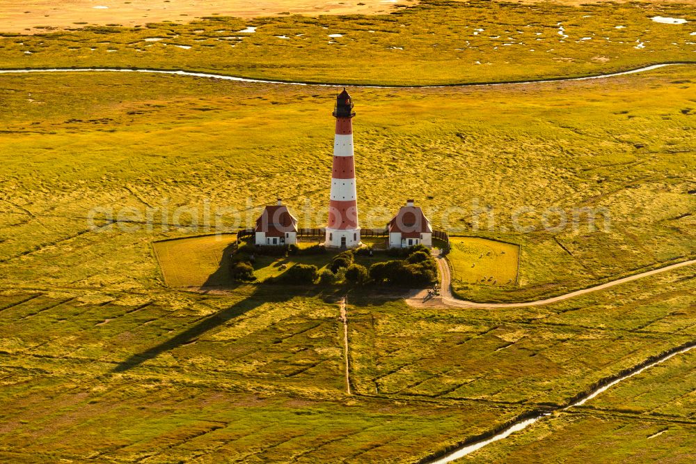 Westerhever from the bird's eye view: Lighthouse Westerheversand as a historic seafaring character in the coastal area of North Sea in Westerhever in the state Schleswig-Holstein