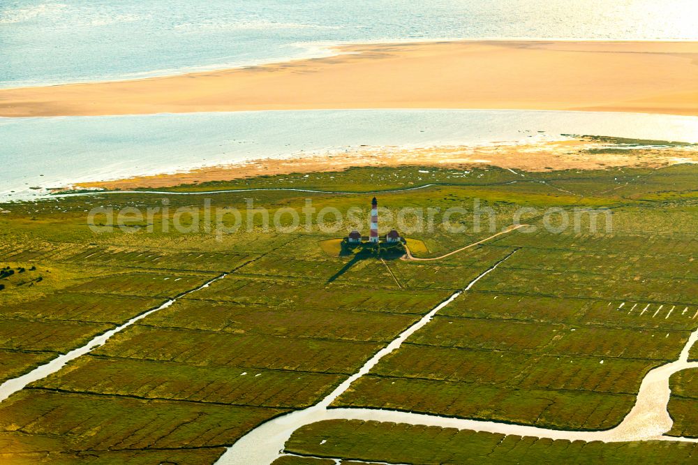 Aerial image Westerhever - Lighthouse Westerheversand as a historic seafaring character in the coastal area of North Sea in Westerhever in the state Schleswig-Holstein