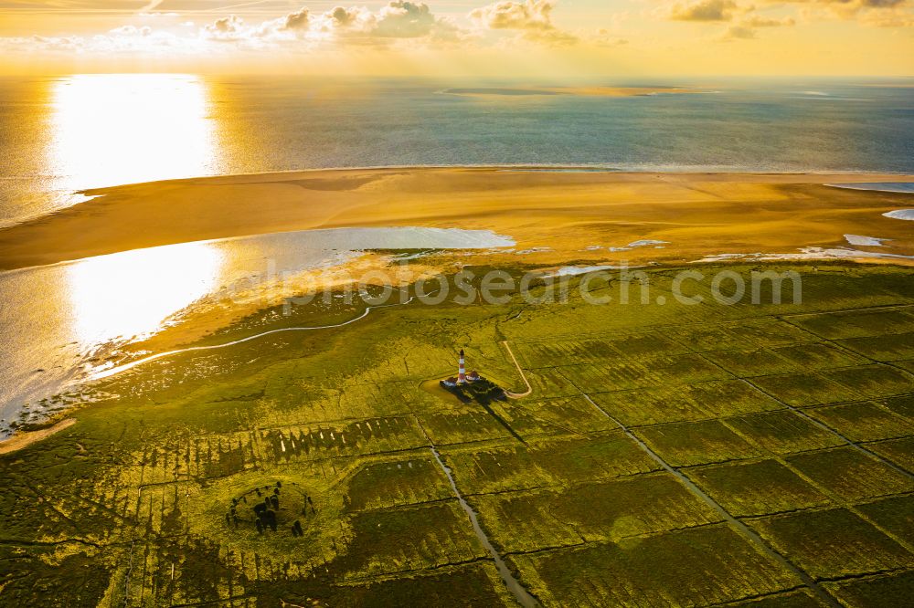 Westerhever from the bird's eye view: Lighthouse Westerheversand as a historic seafaring character in the coastal area of North Sea in Westerhever in the state Schleswig-Holstein