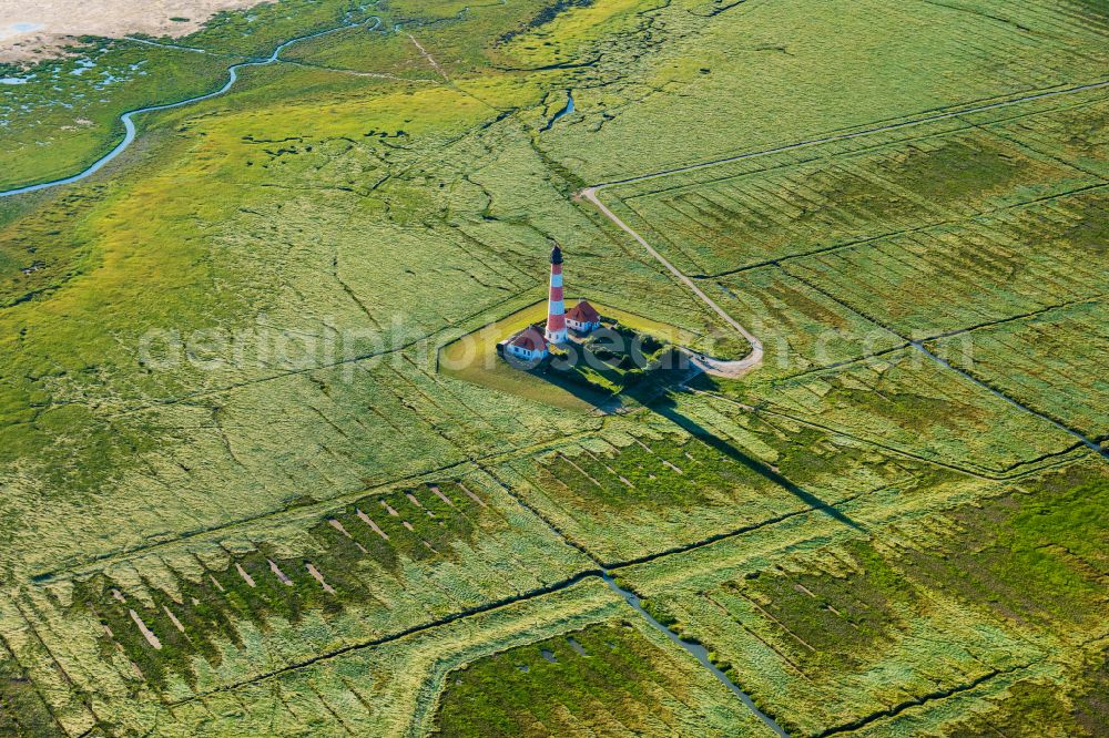 Westerhever from the bird's eye view: Lighthouse Westerheversand as a historic seafaring character in the coastal area of North Sea in Westerhever in the state Schleswig-Holstein