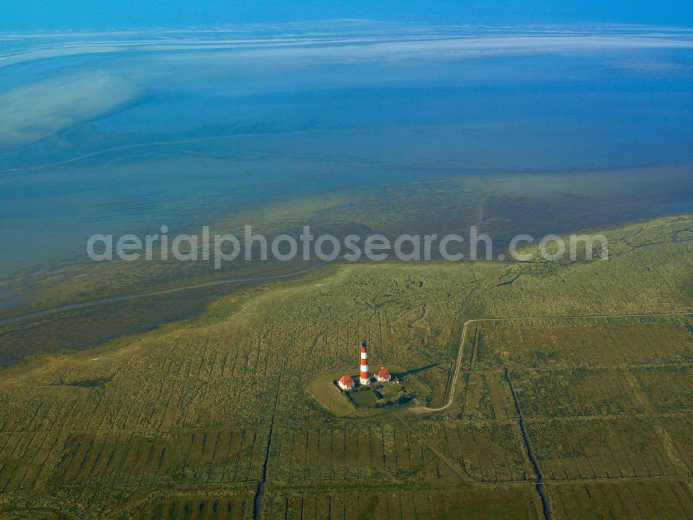 Westerhever from the bird's eye view: The lighthouse Westerheversand is situated on a mound prior Westerhever place. The lighthouse is the most famous landmark of the peninsula Eiderstedt in Schleswig-Holstein