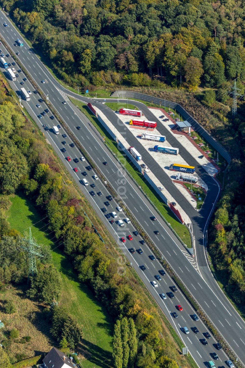 Hagen from the bird's eye view: Lorries - parking spaces at the highway rest stop and parking of the BAB A 1 in Hagen in the state North Rhine-Westphalia, Germany