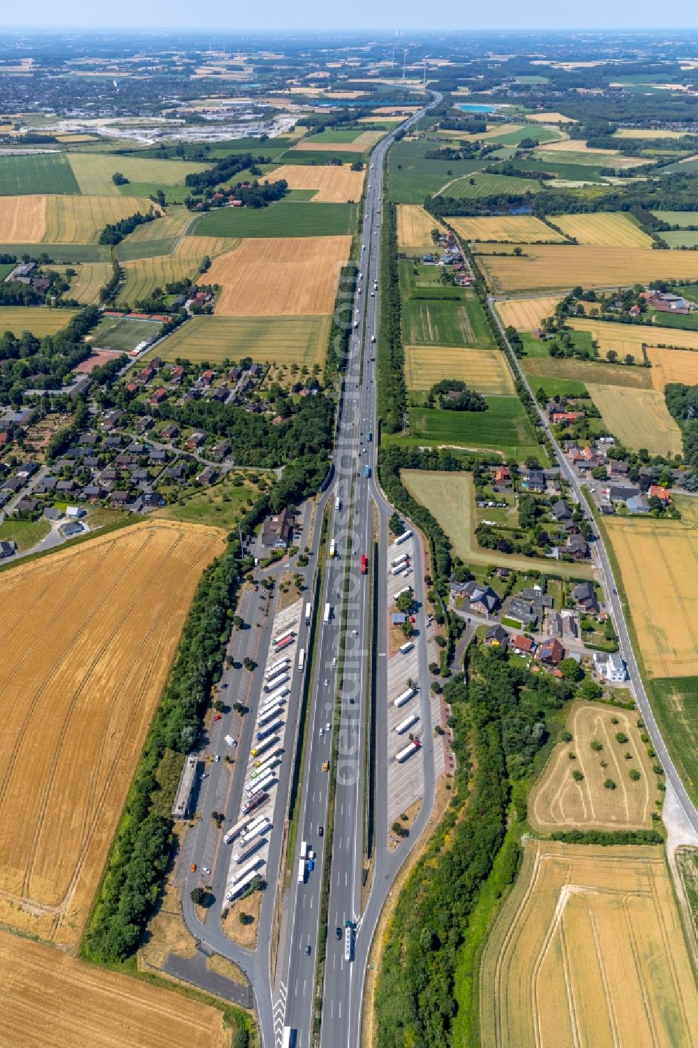 Vellern from the bird's eye view: Lorries - parking spaces at the highway rest stop and parking of the BAB A 2 in Vellern in the state North Rhine-Westphalia, Germany