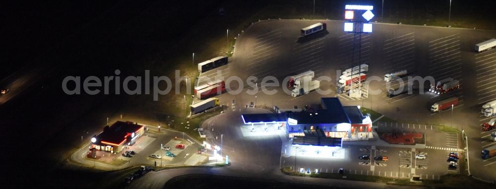 Aerial image Sandersdorf-Brehna - Night view Lorries - parking spaces at the highway rest stop and parking of the BAB A 9 zur B183 in San dersdorf-Brehna in the state Saxony-Anhalt