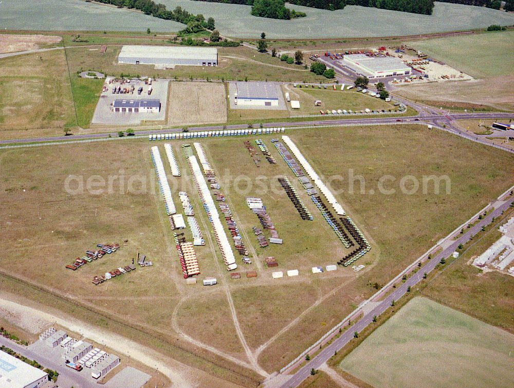 Liebenthal from above - GDR truck of the brand IFA W50 - L60 - as an unsellable new production in storage areas and open space warehouses of Thiele KG on the street MEGA-Allee in Liebenthal in the state Brandenburg, Germany