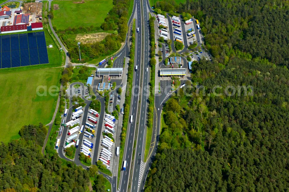 Kleinlangheim from the bird's eye view: Lorries - parking spaces at the highway rest stop and parking of the BAB A 3, Serways Raststaette Haidt Sued in Kleinlangheim in the state Bavaria, Germany