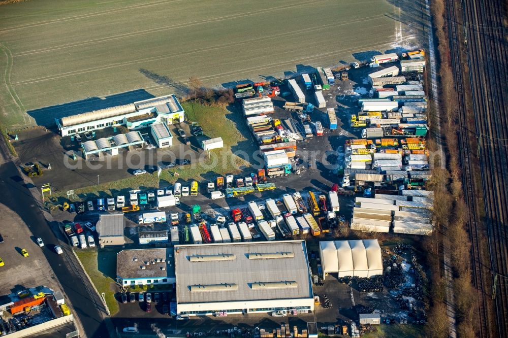 Aerial photograph Hamm - Truck dealership building and area of Daniel Konegen with numerous trucks and its neighbor Bronk building materials trade in Hamm in the state North Rhine-Westphalia