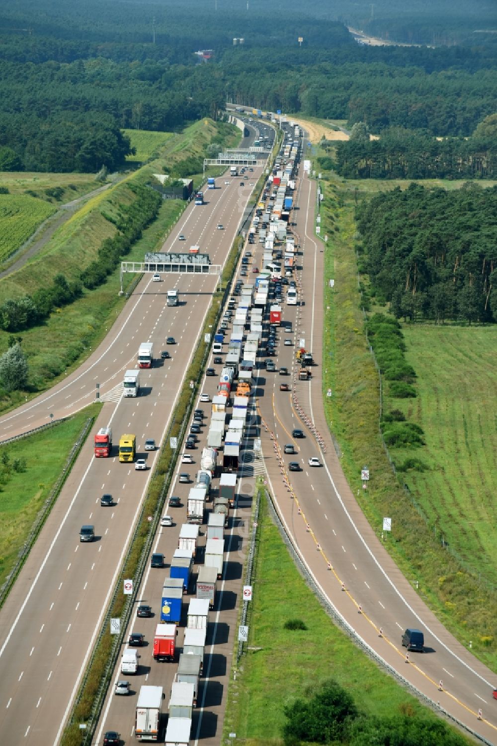 Michendorf from above - Lorries freight by road along the federal highway and motorway A10 in Michendorf in the state Brandenburg, Germany