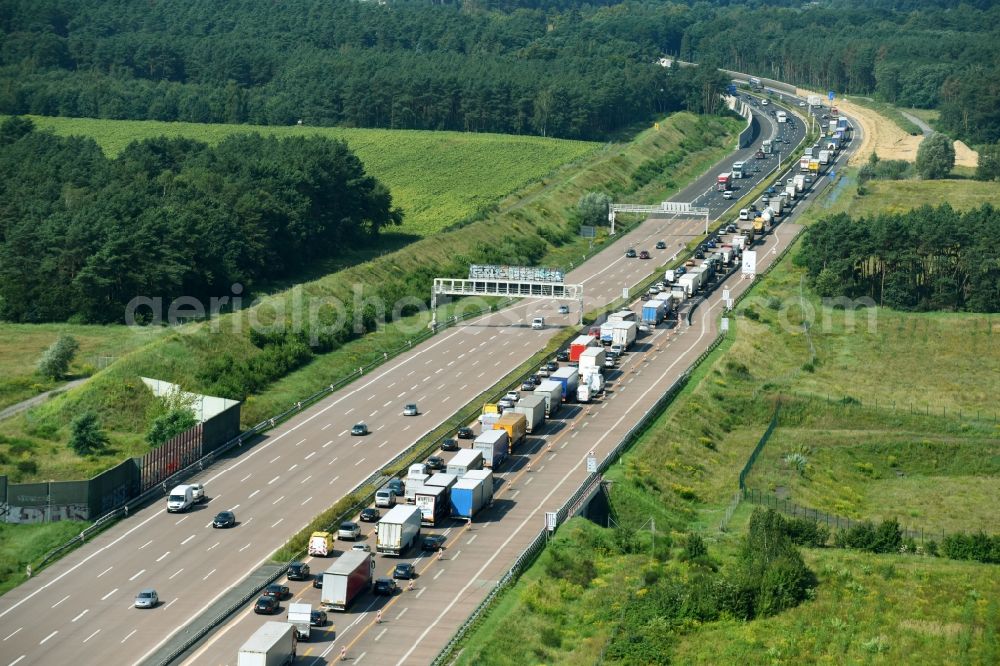 Michendorf from above - Lorries freight by road along the federal highway and motorway A10 in Michendorf in the state Brandenburg, Germany