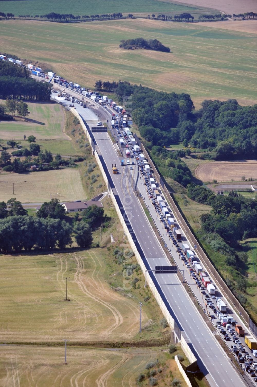 Aerial photograph Triptis - Buildings and route of the motorway A9 motorway with four lanes now. Currently, reconstruction, expansion and new construction work is underway for the six-lane expansion of Highway 9 between Triptis and Schleiz by Wayss & Freytag Ingenieurbau and EUROVIA VINCI in Thuringia