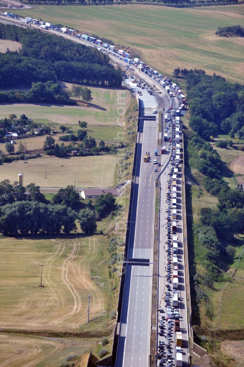 Triptis from above - Buildings and route of the motorway A9 motorway with four lanes now. Currently, reconstruction, expansion and new construction work is underway for the six-lane expansion of Highway 9 between Triptis and Schleiz by Wayss & Freytag Ingenieurbau and EUROVIA VINCI in Thuringia