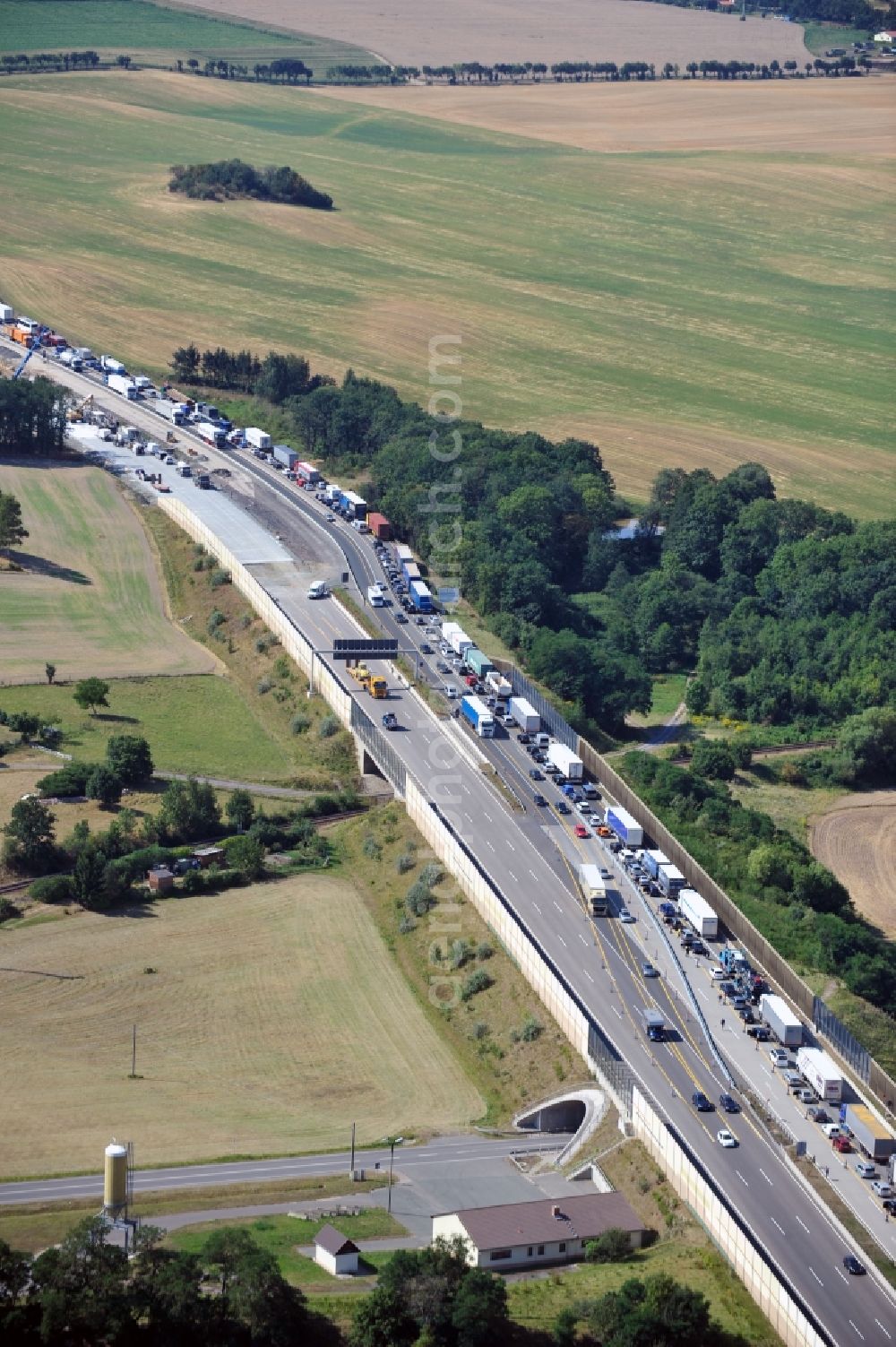 Aerial photograph Triptis - Buildings and route of the motorway A9 motorway with four lanes now. Currently, reconstruction, expansion and new construction work is underway for the six-lane expansion of Highway 9 between Triptis and Schleiz by Wayss & Freytag Ingenieurbau and EUROVIA VINCI in Thuringia