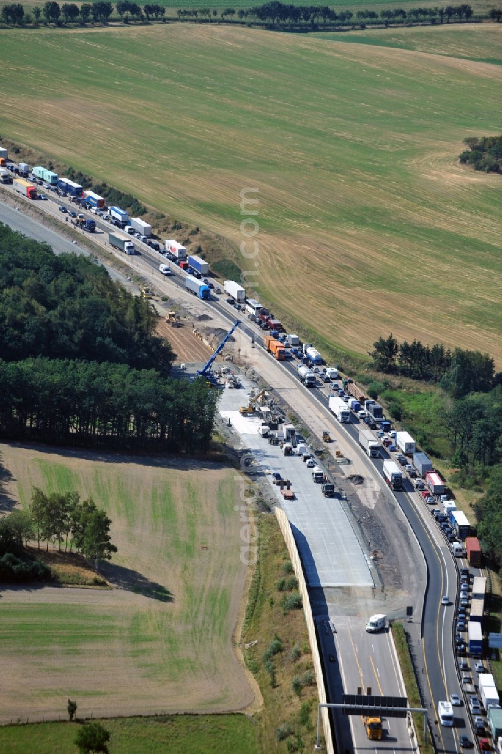 Triptis from above - Buildings and route of the motorway A9 motorway with four lanes now. Currently, reconstruction, expansion and new construction work is underway for the six-lane expansion of Highway 9 between Triptis and Schleiz by Wayss & Freytag Ingenieurbau and EUROVIA VINCI in Thuringia