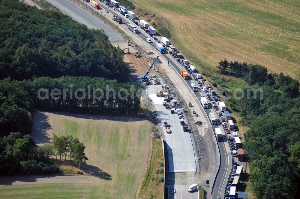 Triptis from the bird's eye view: Buildings and route of the motorway A9 motorway with four lanes now. Currently, reconstruction, expansion and new construction work is underway for the six-lane expansion of Highway 9 between Triptis and Schleiz by Wayss & Freytag Ingenieurbau and EUROVIA VINCI in Thuringia