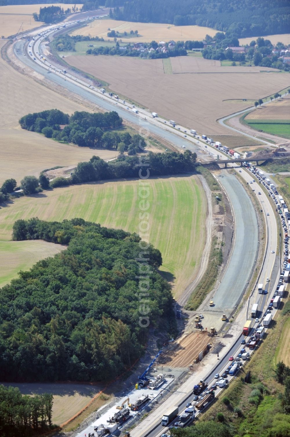 Aerial image Triptis - Buildings and route of the motorway A9 motorway with four lanes now. Currently, reconstruction, expansion and new construction work is underway for the six-lane expansion of Highway 9 between Triptis and Schleiz by Wayss & Freytag Ingenieurbau and EUROVIA VINCI in Thuringia