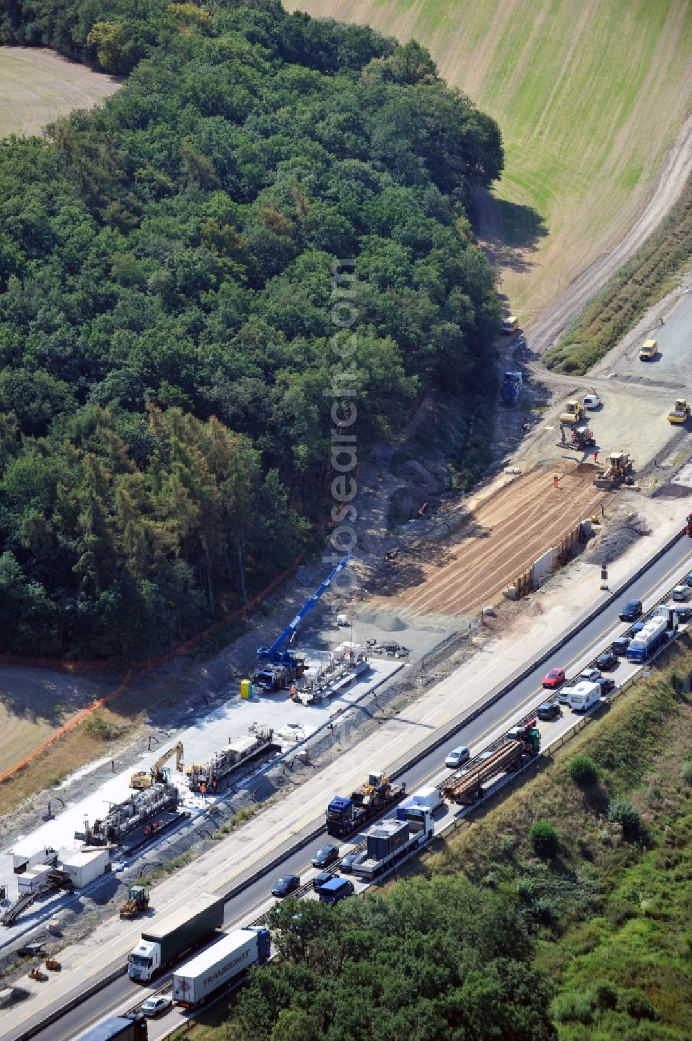 Aerial photograph Triptis - Buildings and route of the motorway A9 motorway with four lanes now. Currently, reconstruction, expansion and new construction work is underway for the six-lane expansion of Highway 9 between Triptis and Schleiz by Wayss & Freytag Ingenieurbau and EUROVIA VINCI in Thuringia