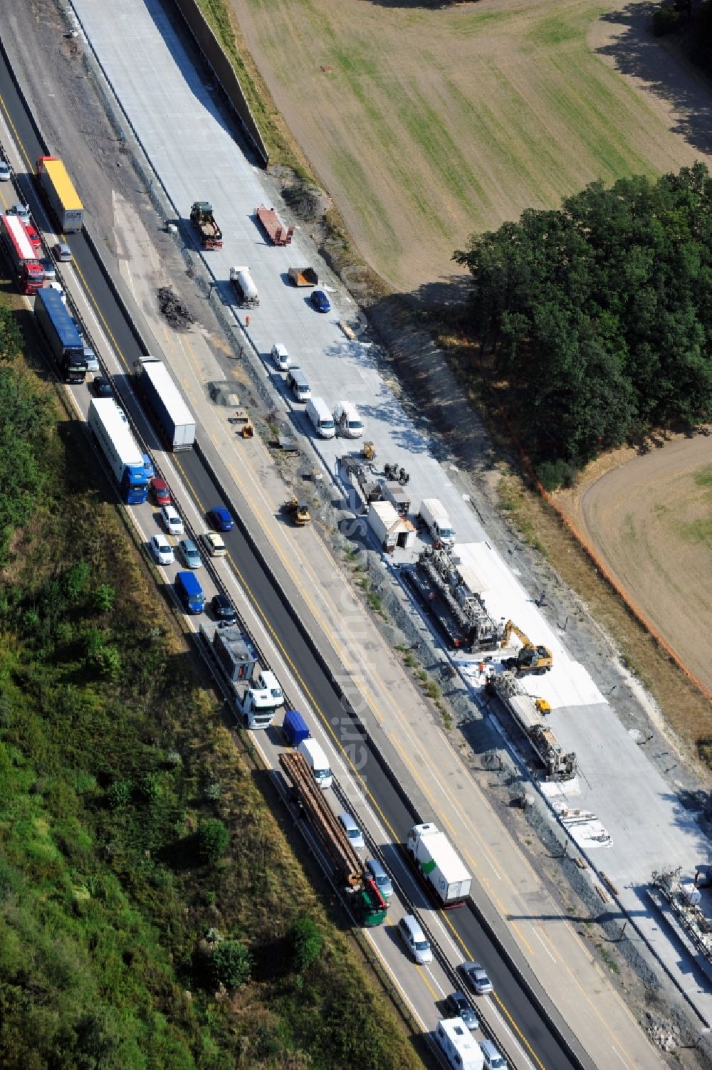 Aerial photograph Triptis - Buildings and route of the motorway A9 motorway with four lanes now. Currently, reconstruction, expansion and new construction work is underway for the six-lane expansion of Highway 9 between Triptis and Schleiz by Wayss & Freytag Ingenieurbau and EUROVIA VINCI in Thuringia