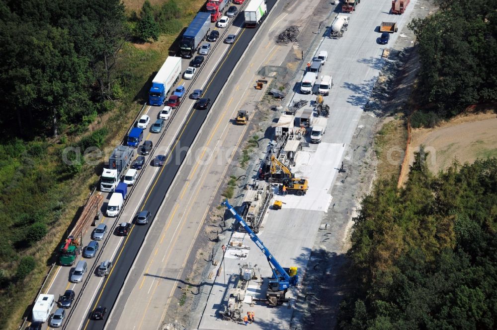 Triptis from the bird's eye view: Buildings and route of the motorway A9 motorway with four lanes now. Currently, reconstruction, expansion and new construction work is underway for the six-lane expansion of Highway 9 between Triptis and Schleiz by Wayss & Freytag Ingenieurbau and EUROVIA VINCI in Thuringia