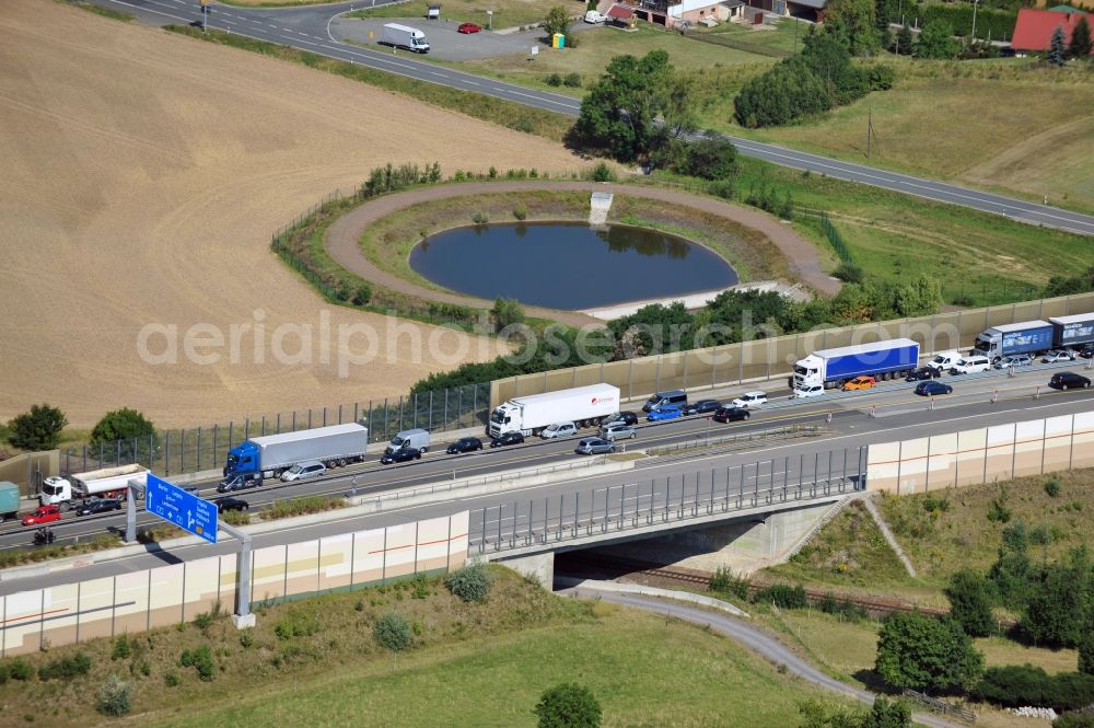 Aerial image Triptis - Buildings and route of the motorway A9 motorway with four lanes now. Currently, reconstruction, expansion and new construction work is underway for the six-lane expansion of Highway 9 between Triptis and Schleiz by Wayss & Freytag Ingenieurbau and EUROVIA VINCI in Thuringia