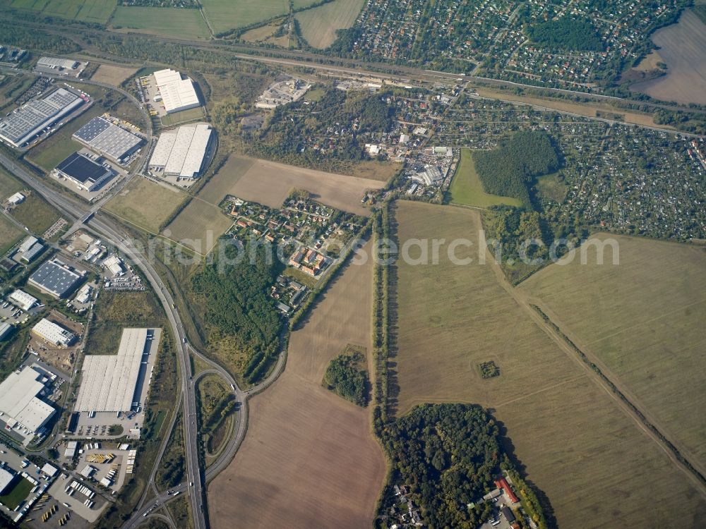 Birkenhain from above - Rural and industrial area around Birkenhain in the state of Brandenburg. The village is surrounded by fields and located in the North of the commercial and industrial area along the federal highway B101. The residential area of Teltow is located in its West