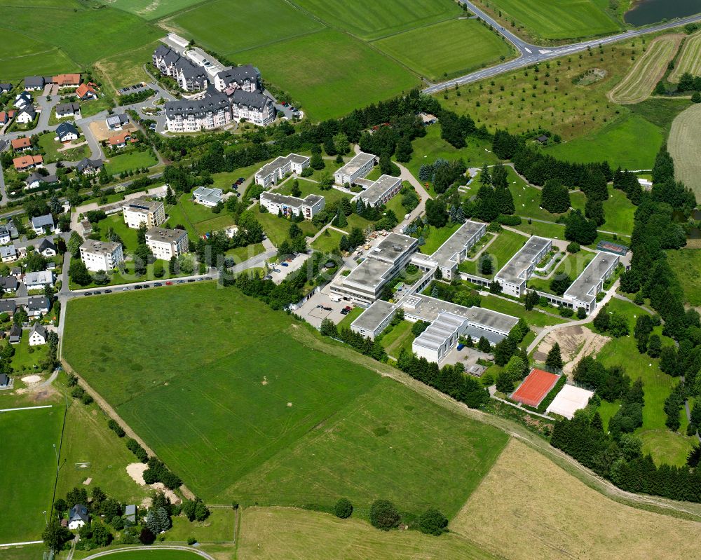 Bad Steben from the bird's eye view: Industrial and commercial area on the edge of agricultural fields and fields in Bad Steben Oberfranken in the state Bavaria, Germany