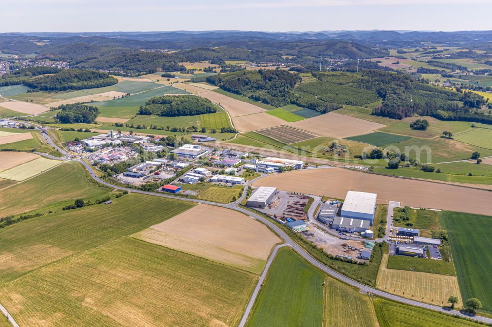 Balve from the bird's eye view: Industrial and commercial area on the edge of agricultural fields and fields in Balve in the state North Rhine-Westphalia, Germany