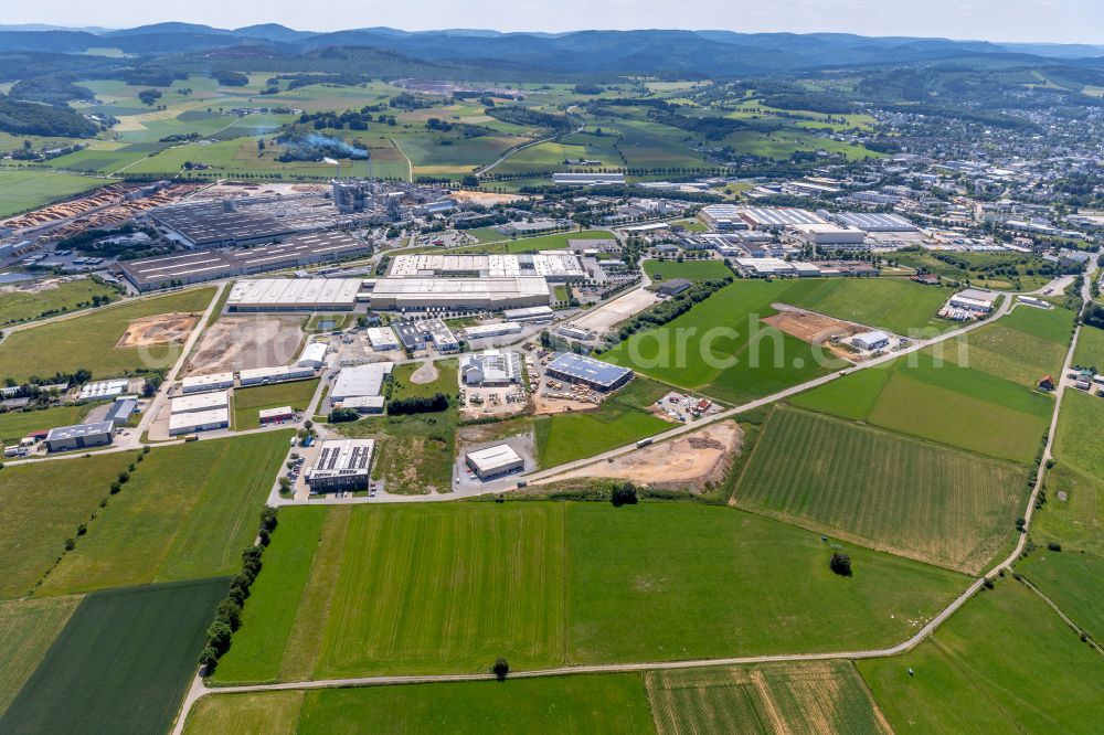 Brilon from above - Industrial and commercial area on the edge of agricultural fields and fields in Brilon at Sauerland in the state North Rhine-Westphalia, Germany