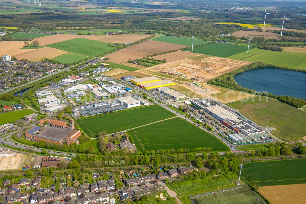 Goch from above - Industrial and commercial area on the edge of agricultural fields and fields on street Pfalzdorfer Strasse in Goch Niederrhein in the state North Rhine-Westphalia, Germany