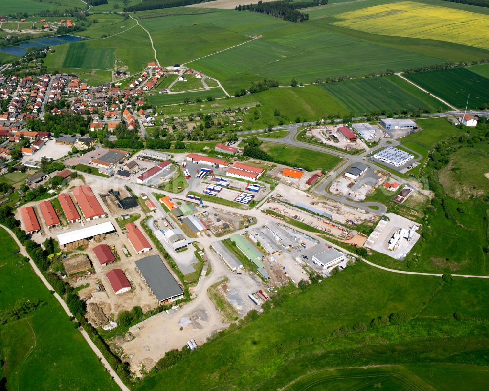 Aerial photograph Hasselfelde - Industrial and commercial area on the edge of agricultural fields and fields in Hasselfelde in the state Saxony-Anhalt, Germany