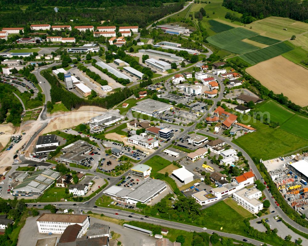 Heumaden from the bird's eye view: Industrial and commercial area on the edge of agricultural fields and fields in Heumaden in the state Baden-Wuerttemberg, Germany